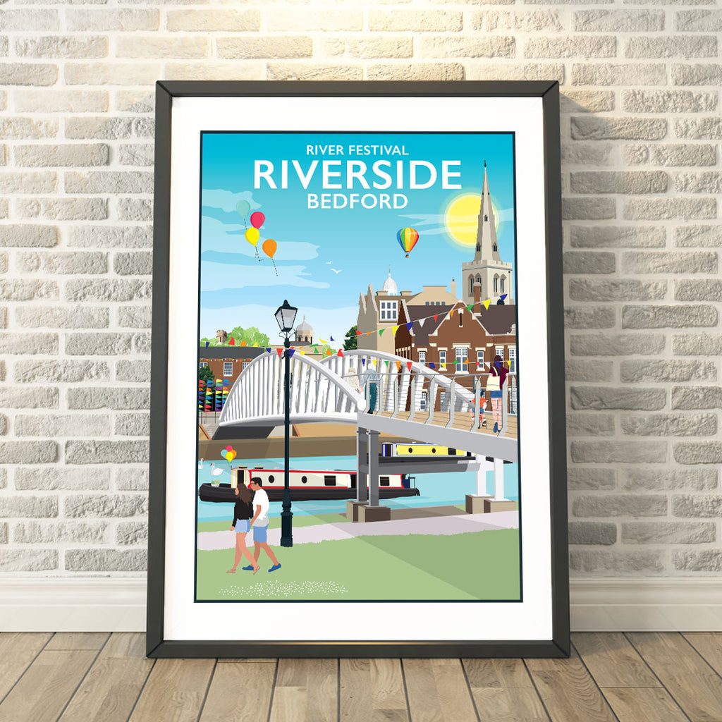 a framed poster of a river side bridge