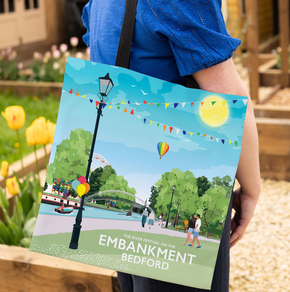 a person holding a book with a picture of a park